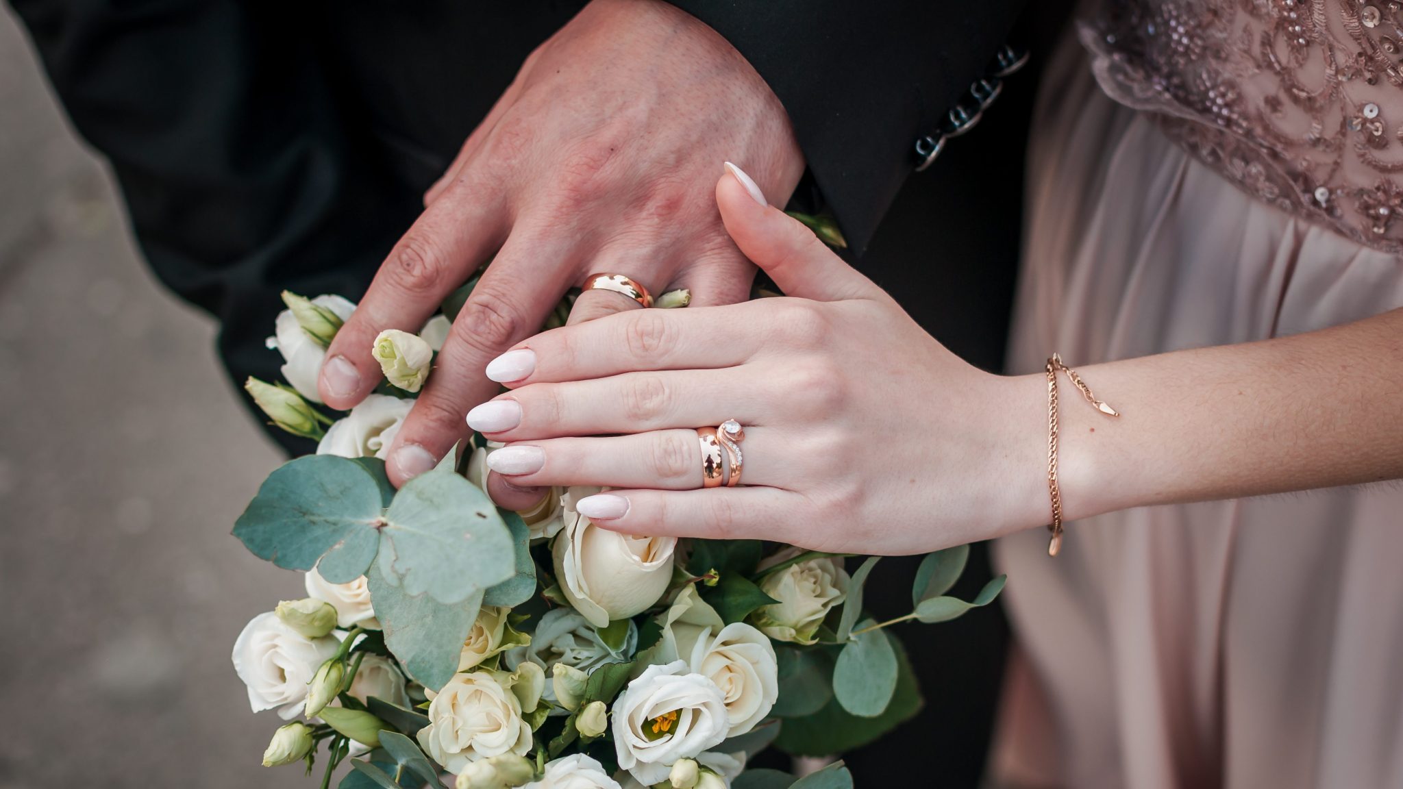Newlyweds showing their wedding rings