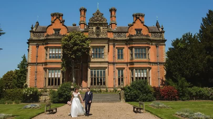 Newly married couple outside Beaumanor Hall